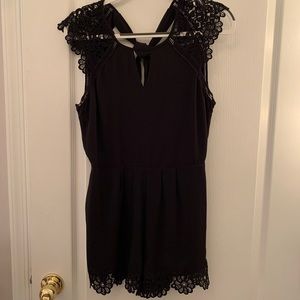 Elegant express black romper for sale, worn only several times in a size 6